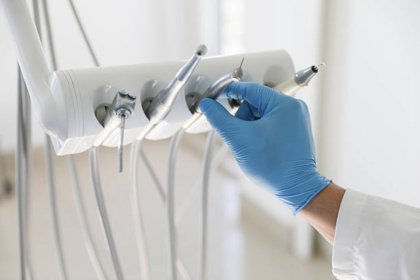 Professional Tooth Extraction technician working in Caldwell County County, NC